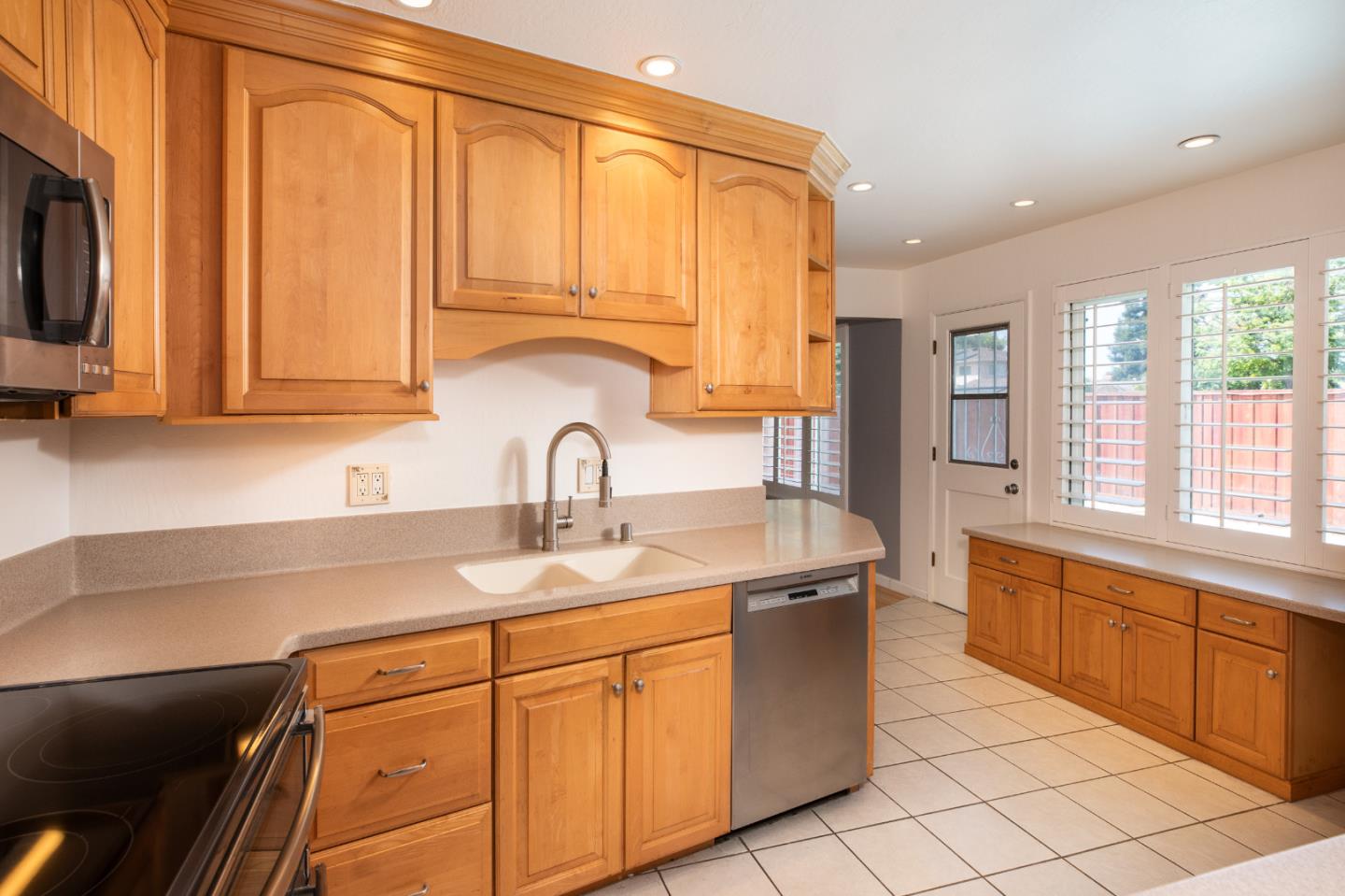 1937 Adelaide Way San Jose, CA 95124 - Photo 11 of 33 a kitchen with stainless steel appliances granite countertop a sink and a microwave