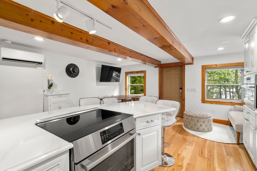 10 Beech Road Wayland, MA 01778 - Photo 6 of 42 a kitchen with a sink and a stove top oven