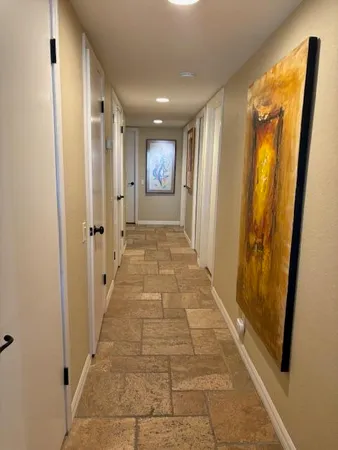 a bedroom with a bed and flat screen tv