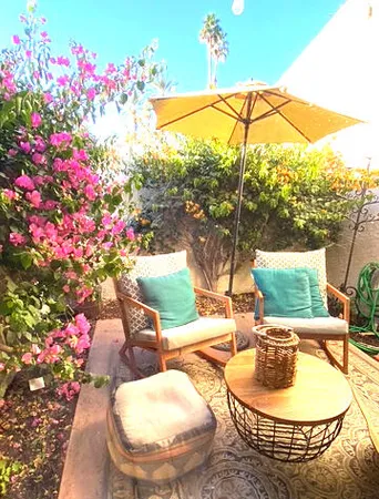 a bedroom with a bed wooden floor and window