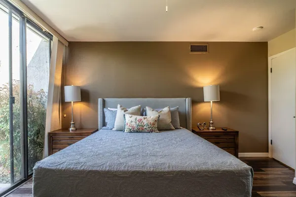 a backyard of a house with table and chairs