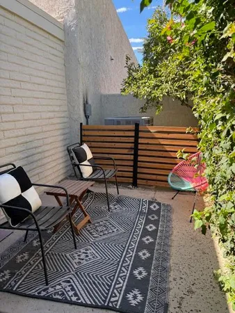 a bedroom with a bed and a table