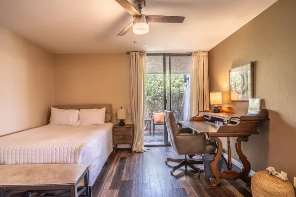 a white bath tub sitting next to a toilet