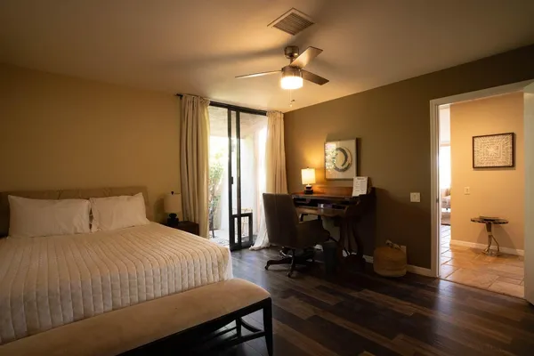 a view of a chairs and table on the wooden floor