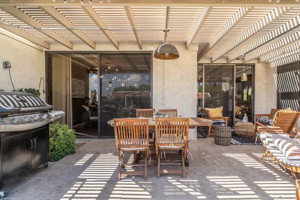 a balcony view with a seating space