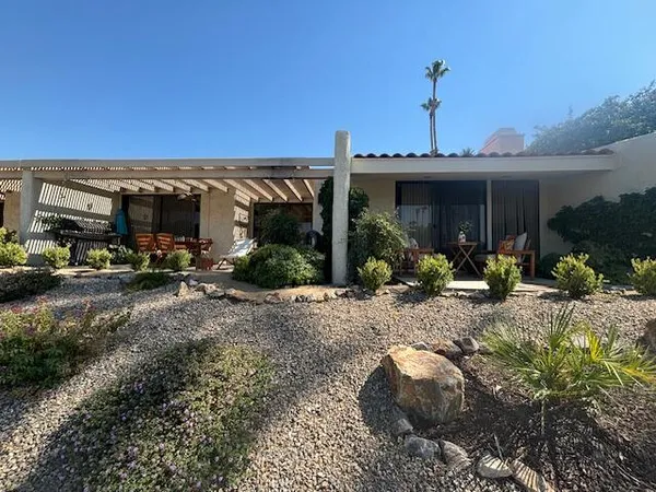 a view of a house with a yard and garage
