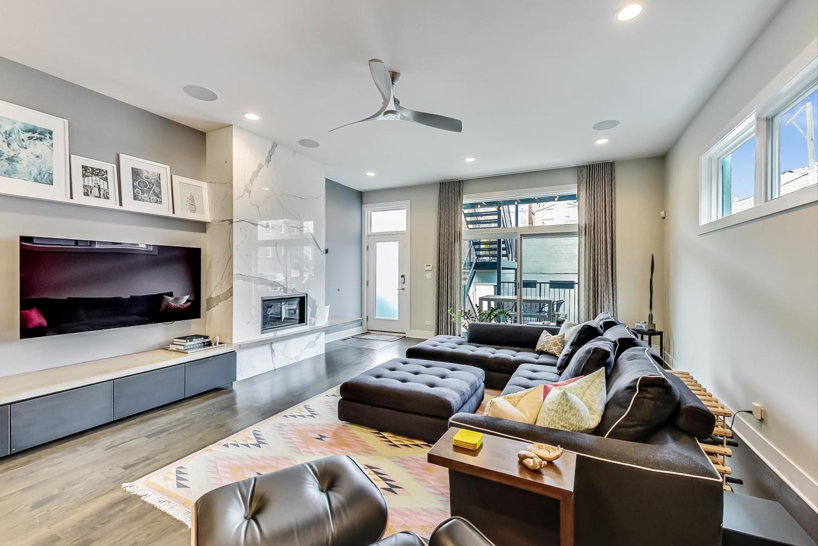 2030 West Rice Street, Unit 1 Chicago, IL 60622 - Photo 2 of 37 a living room with furniture and a flat screen tv