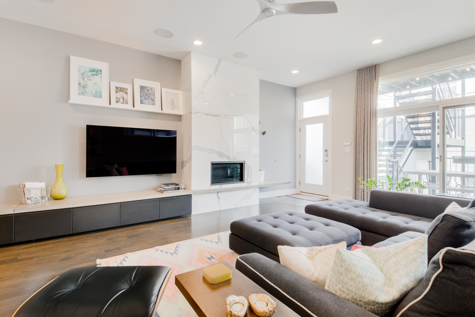 2030 West Rice Street, Unit 1 Chicago, IL 60622 - Photo 3 of 37 a living room with furniture and a flat screen tv