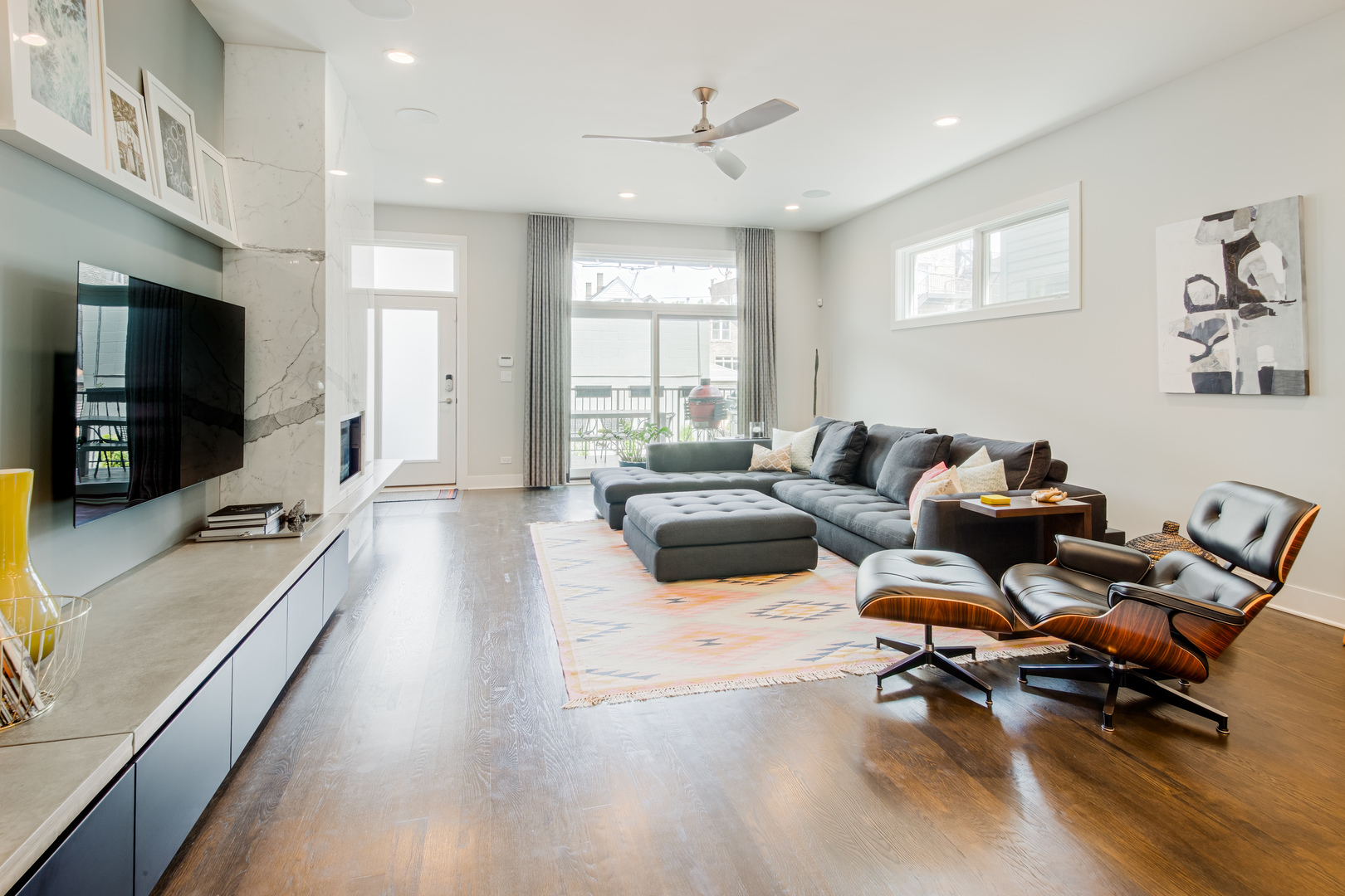 2030 West Rice Street, Unit 1 Chicago, IL 60622 - Photo 5 of 37 a living room with furniture and a flat screen tv