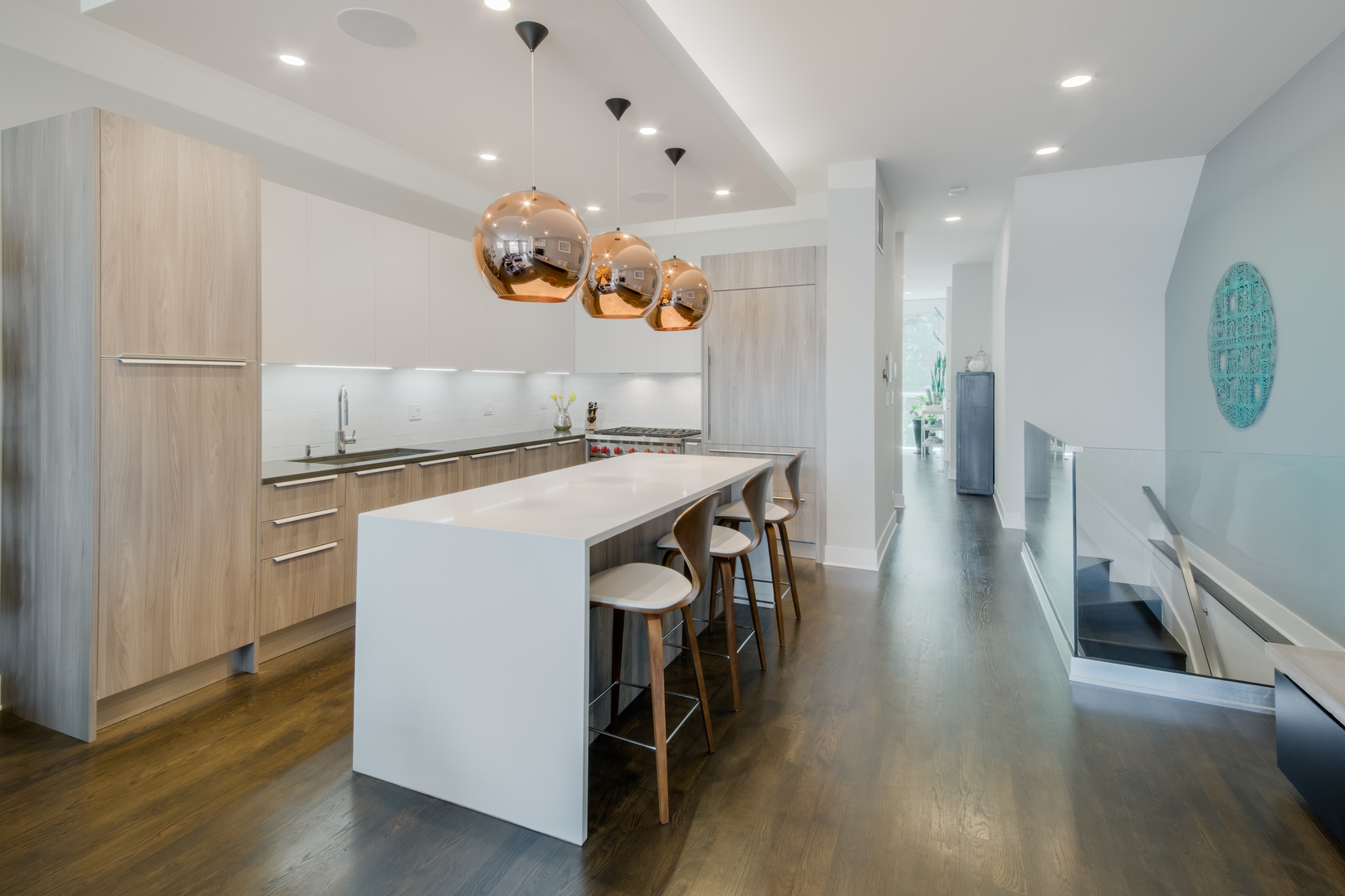 2030 West Rice Street, Unit 1 Chicago, IL 60622 - Photo 7 of 37 a kitchen with stainless steel appliances granite countertop a table chairs and a refrigerator