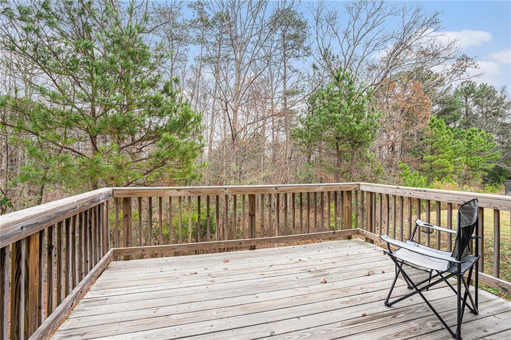2428 Hanover Woods Road Lithonia, GA 30058 - Photo 24 of 26 a view of balcony with wooden floor and fence