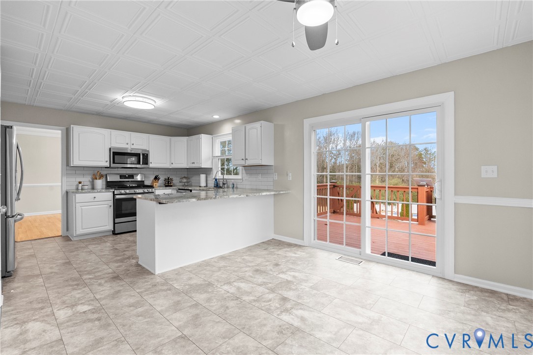842 Hardtimes Road Farmville, VA 23901 - Photo 15 of 50 Kitchen with light stone counters, stainless steel