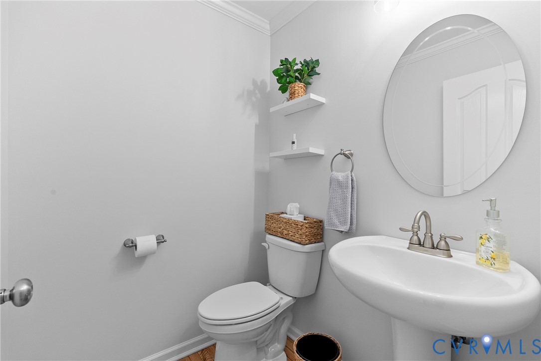 842 Hardtimes Road Farmville, VA 23901 - Photo 19 of 50 Half bath with toilet and crown molding