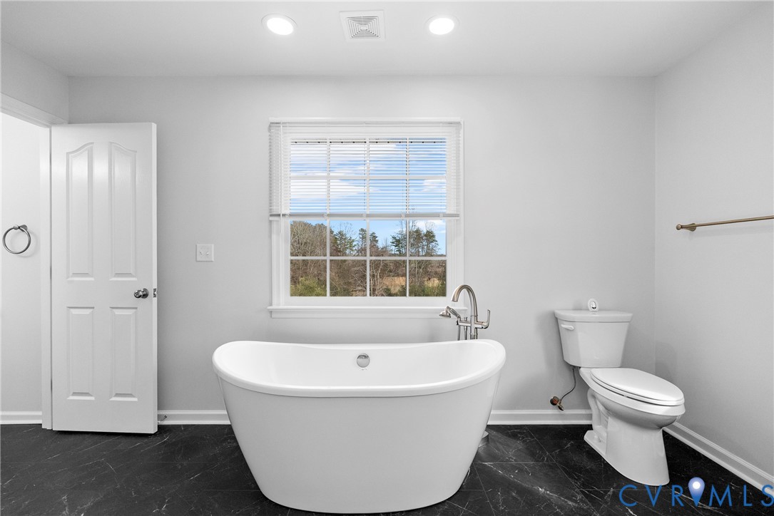 842 Hardtimes Road Farmville, VA 23901 - Photo 34 of 50 Full bath with dark marble finish floors, a soakin