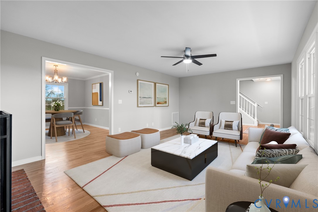 842 Hardtimes Road Farmville, VA 23901 - Photo 6 of 50 Living area with wood finished floors, a chandelie