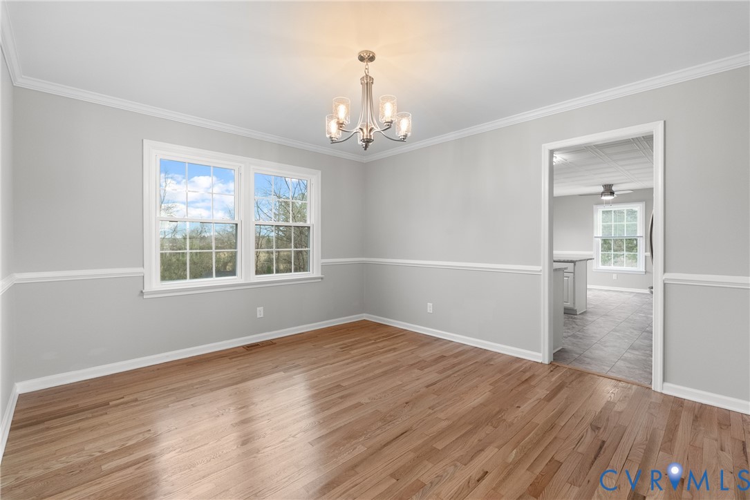 842 Hardtimes Road Farmville, VA 23901 - Photo 10 of 50 Empty room with light wood finished floors, a chan