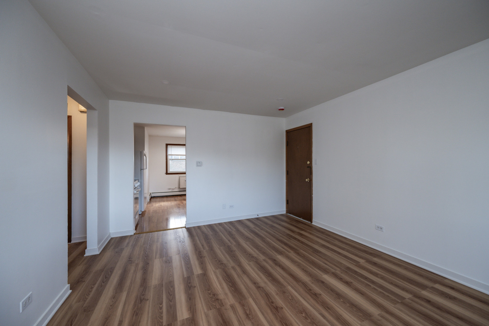 14450 Jefferson Avenue, Unit 2E Orland Park, IL 60462 - Photo 4 of 8 a view of a room with wooden floor and stairs