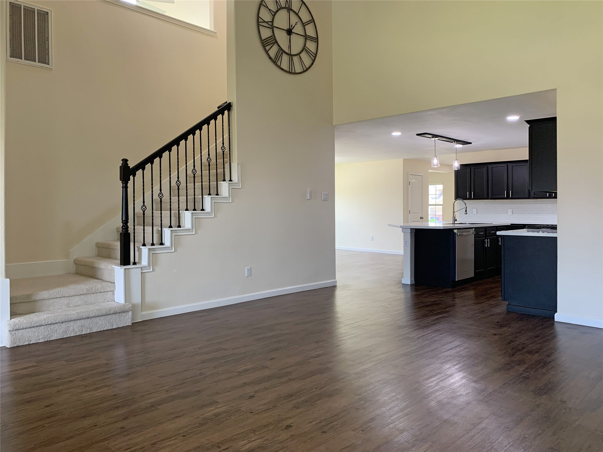 5612 Rainflower Terrace Lane Spring, TX 77389 - Photo 16 of 50 a view of kitchen with microwave and wooden floor
