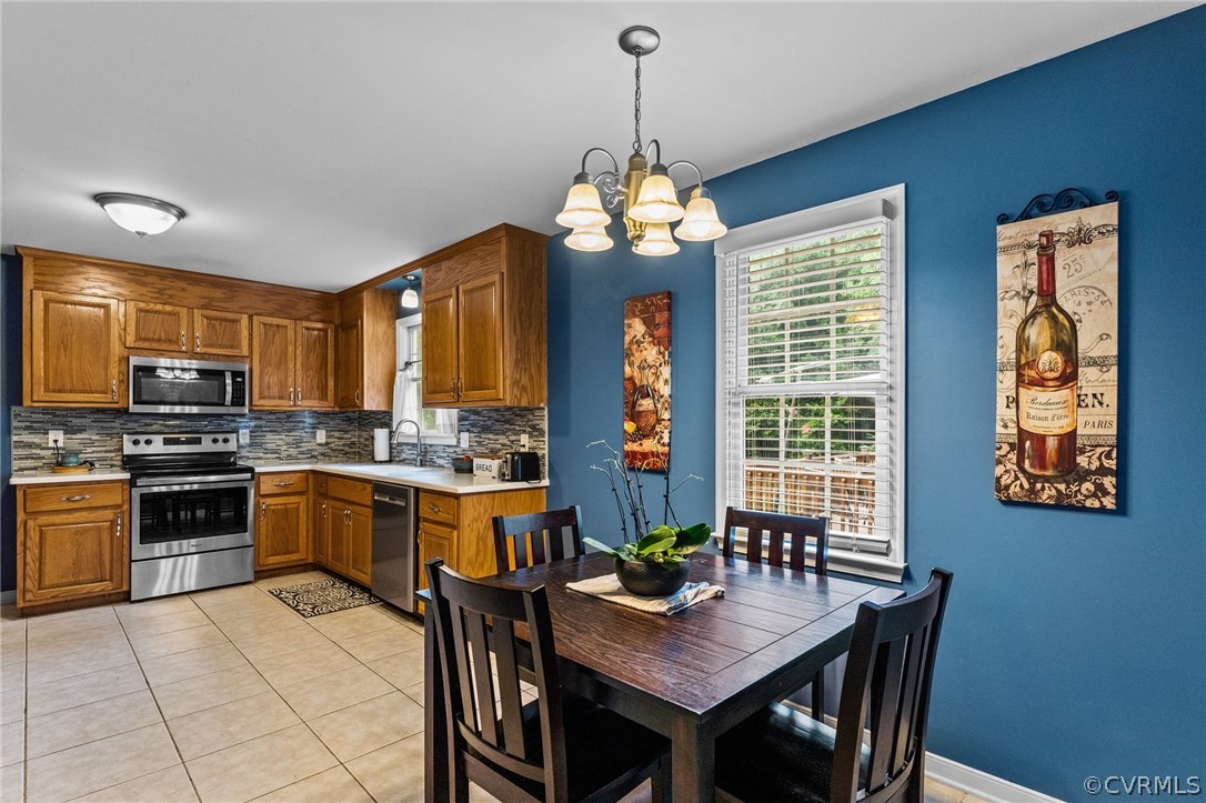 14419 Gatewood Road Dewitt, VA 23840 - Photo 11 of 36 a kitchen with granite countertop wooden cabinets and stainless steel appliances