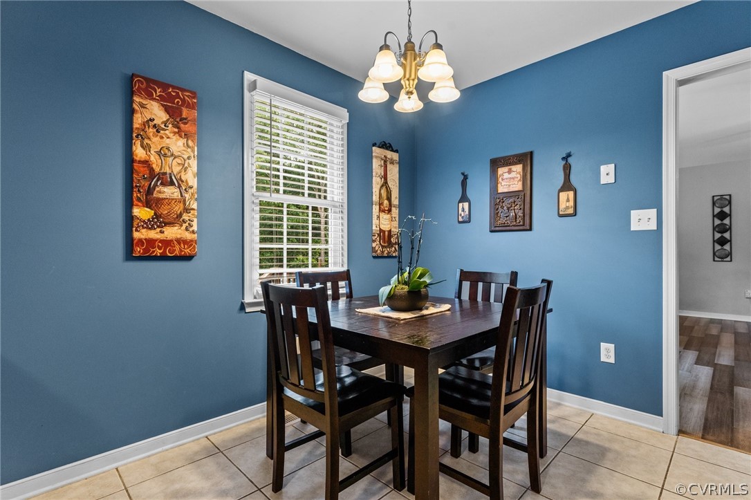 14419 Gatewood Road Dewitt, VA 23840 - Photo 13 of 36 a view of a dining room with furniture and chandelier