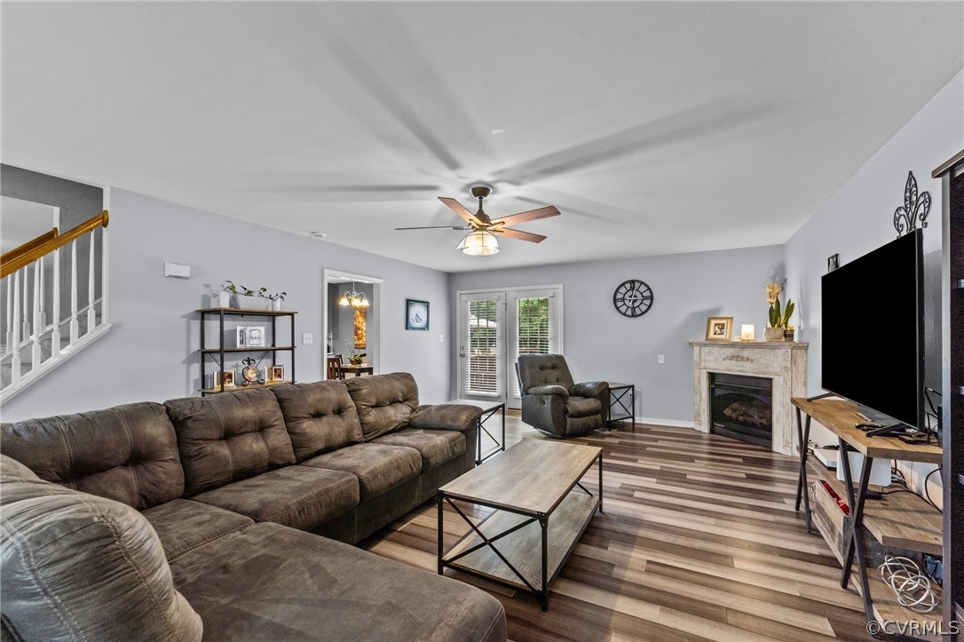 14419 Gatewood Road Dewitt, VA 23840 - Photo 14 of 36 a living room with furniture a flat screen tv and a fireplace