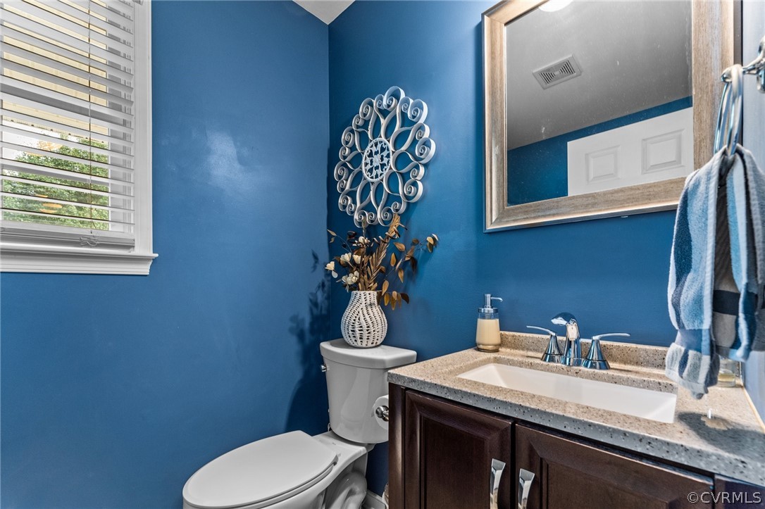 14419 Gatewood Road Dewitt, VA 23840 - Photo 16 of 36 a bathroom with a sink a toilet and a mirror