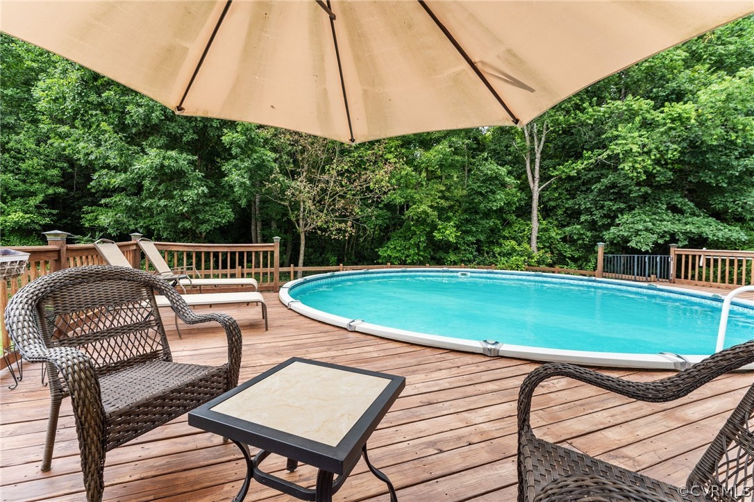 14419 Gatewood Road Dewitt, VA 23840 - Photo 31 of 36 a view of a chairs and table in the patio