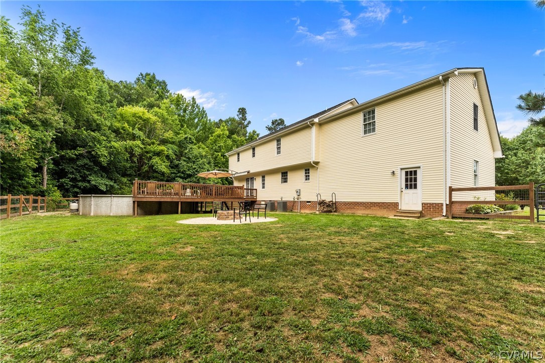 14419 Gatewood Road Dewitt, VA 23840 - Photo 36 of 36 a view of a backyard with plants and a garden