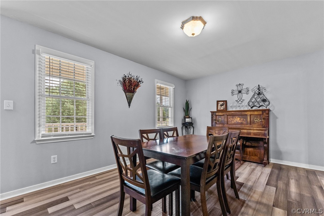 14419 Gatewood Road Dewitt, VA 23840 - Photo 6 of 36 a view of a dining room with furniture and wooden floor