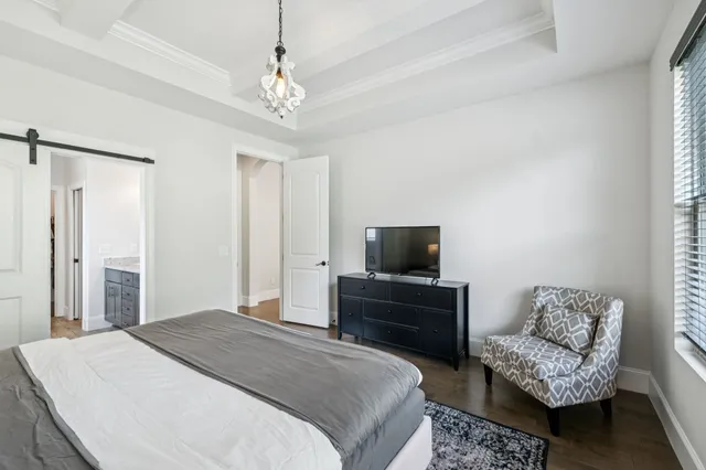 a bathroom with a granite countertop sink a toilet and a mirror