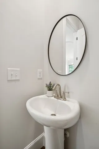 a bedroom with a bed and a desk