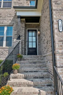 a front view of a house with glass windows