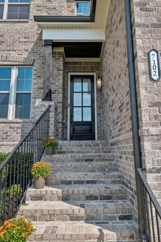 a front view of a house with glass windows