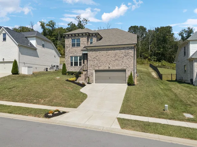 a view of a patio with table and chairs and potted plants