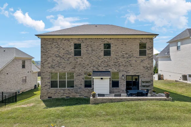 an aerial view of residential house with outdoor space