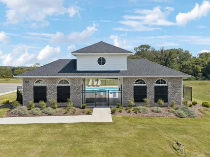 a front view of house with yard in front of it