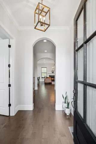 a view of a hallway view with staircase