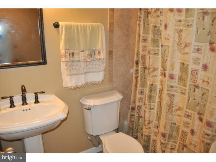 1141 Oliver Road Huntingdon Valley, PA 19006 - Photo 23 of 25 a bathroom with a sink toilet and shower