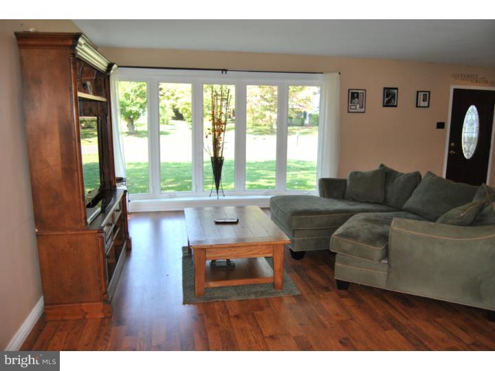 1141 Oliver Road Huntingdon Valley, PA 19006 - Photo 9 of 25 a living room with furniture and a large window