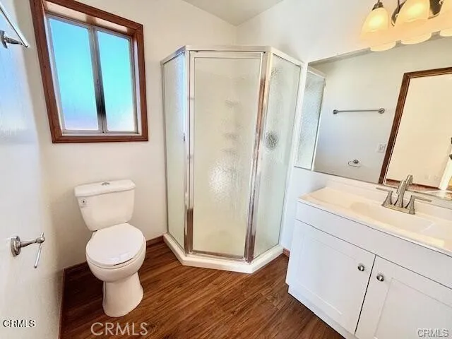 a bathroom with a toilet sink and a mirror