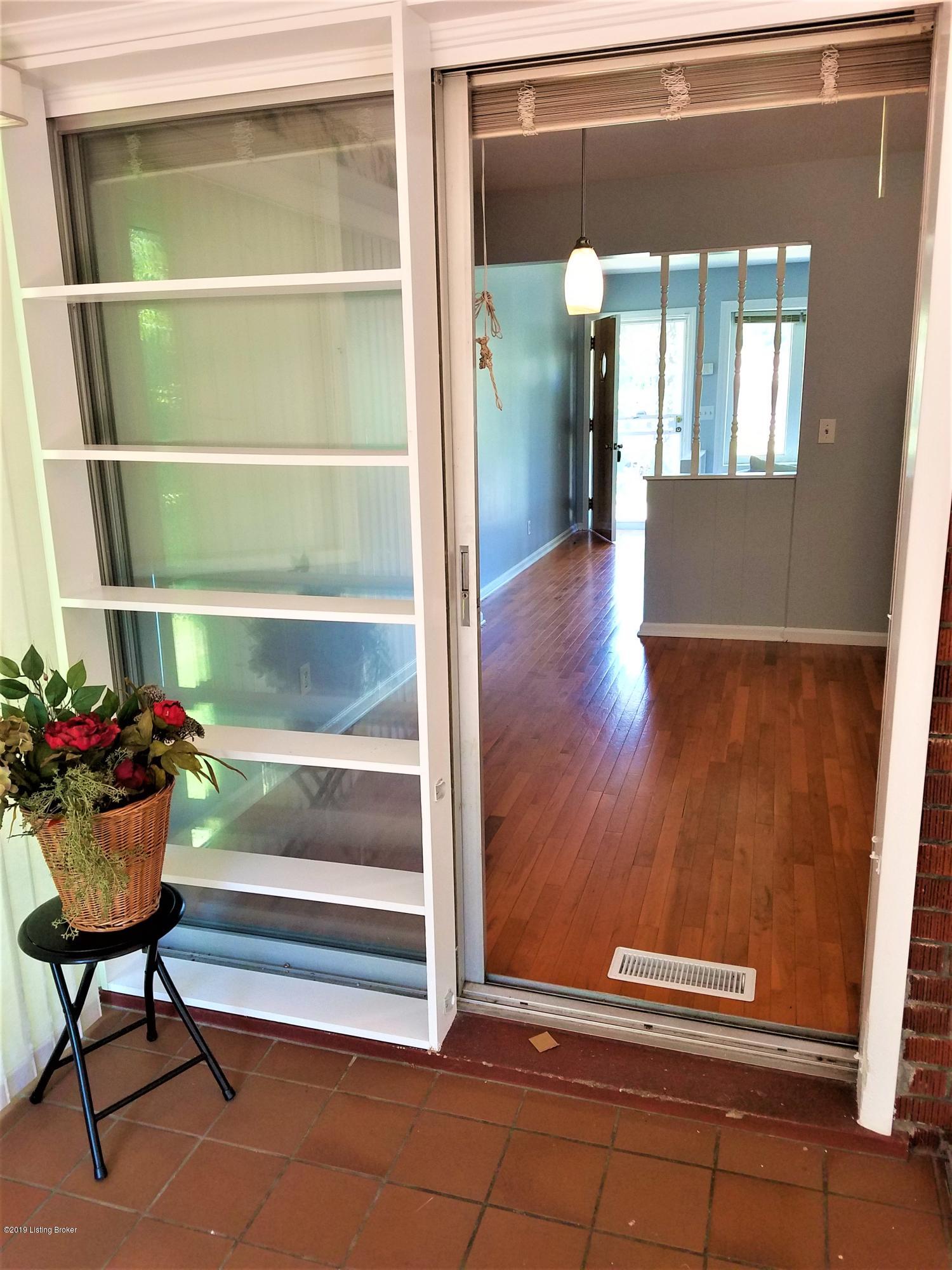 7710 Crestline Road Louisville, KY 40214 - Photo 13 of 34 Crestline Sunroom to house 1