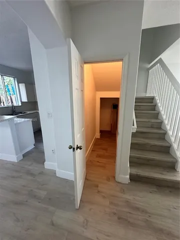 a view of a hallway view with staircase