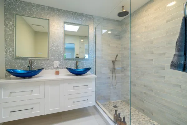 a kitchen with kitchen island a sink appliances and cabinets