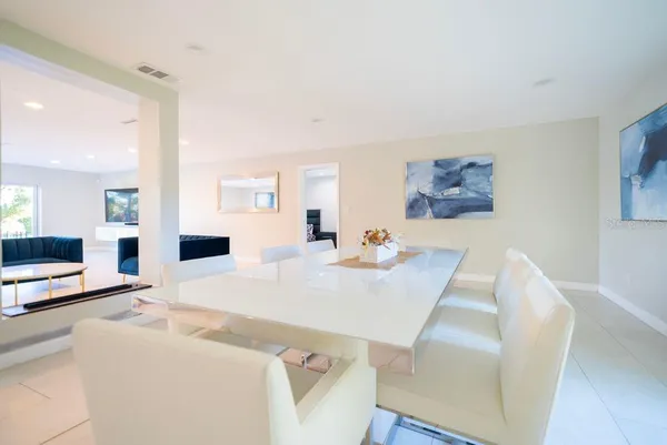 a kitchen with a sink a stove and a refrigerator