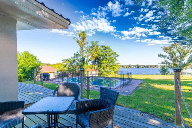 a view of a house with a yard porch and sitting area