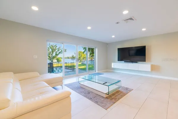 a view of a dining room with furniture and a window