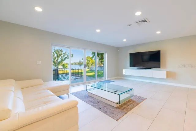 a view of a dining room with furniture and a window