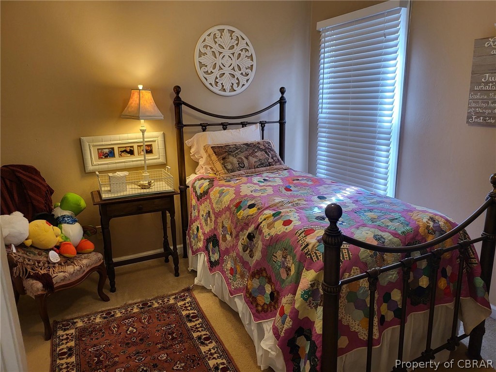 2449 Everglades Road Norfolk, VA 23518 - Photo 23 of 31 a bedroom with a bed and a chandelier