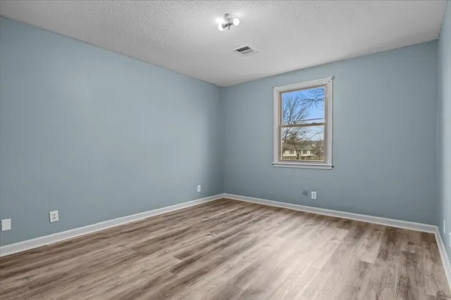 a bedroom with a bed and a closet