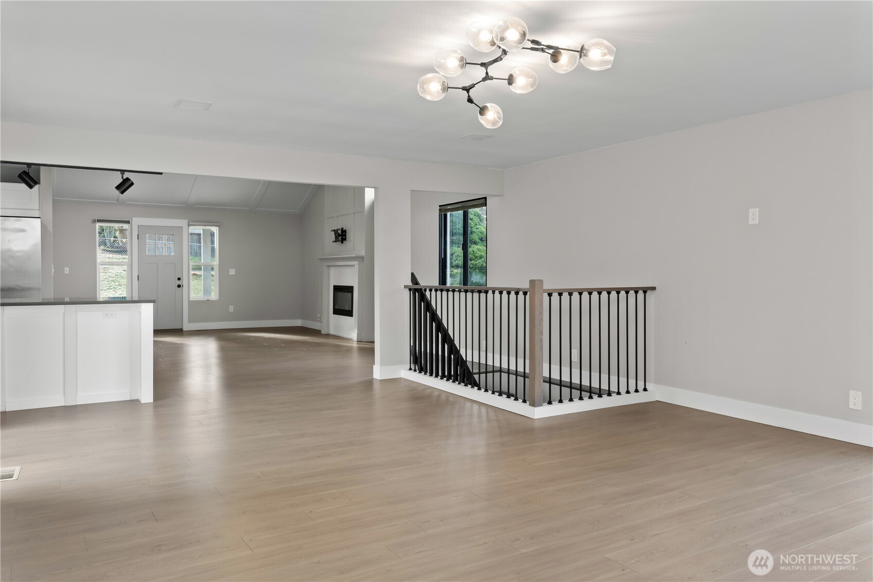 625 173rd Street South Spanaway, WA 98387 - Photo 11 of 35 an empty room with wooden floor and windows
